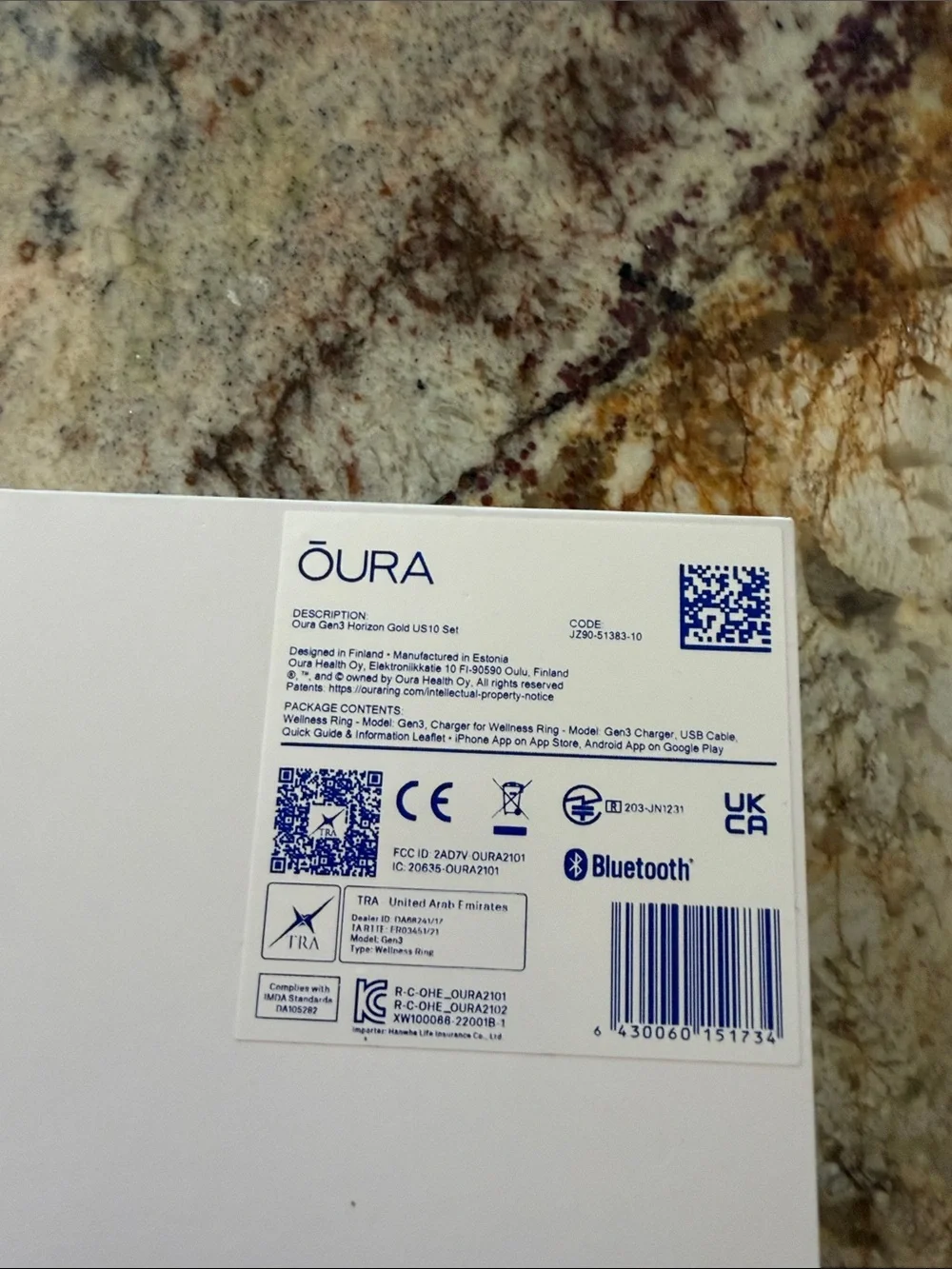 Oura Ring Model Gen 3. Charger for wellness ring with USB cable.